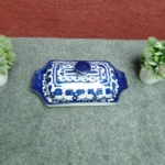 Angled top view of handmade Multani blue pottery butter dish showing lid pattern