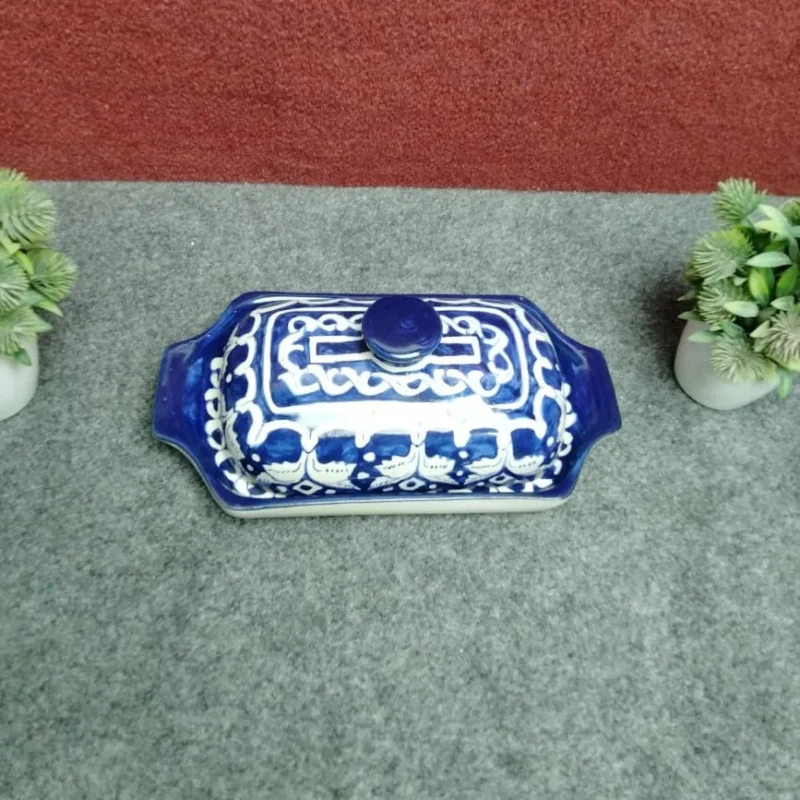 Angled top view of handmade Multani blue pottery butter dish showing lid pattern