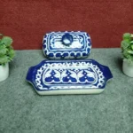 Large blue pottery butter dish with lid removed showing hand painted serving tray