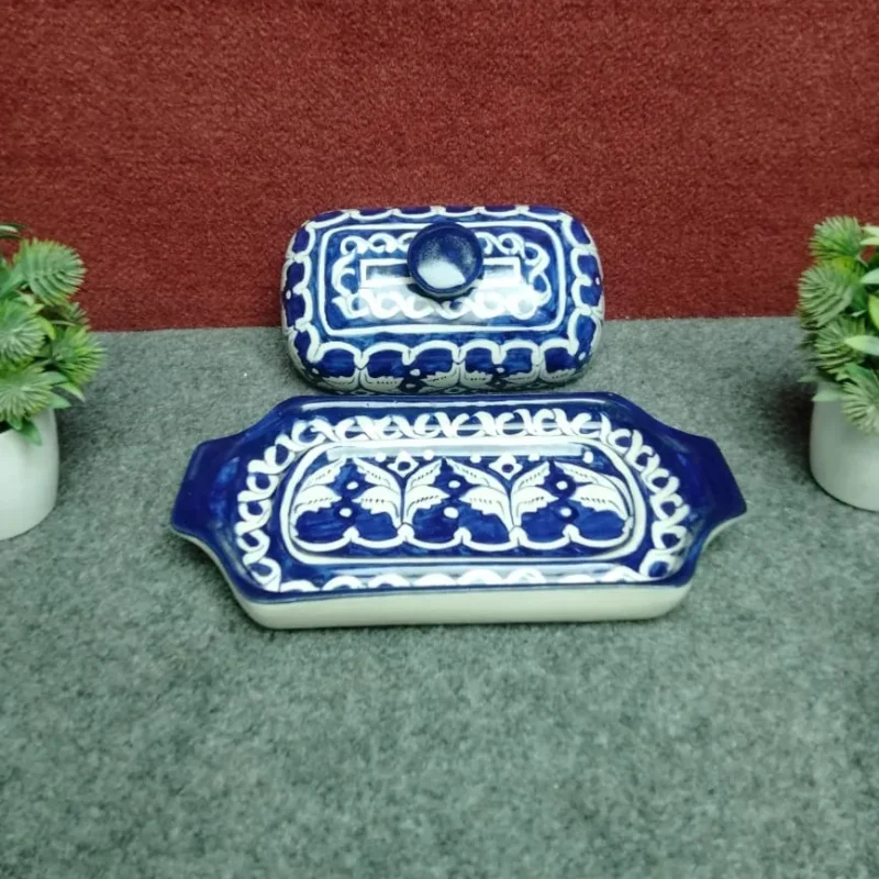 Large blue pottery butter dish with lid removed showing hand painted serving tray