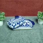 Multani blue pottery butter dish with ceramic lid tilted open on the tray