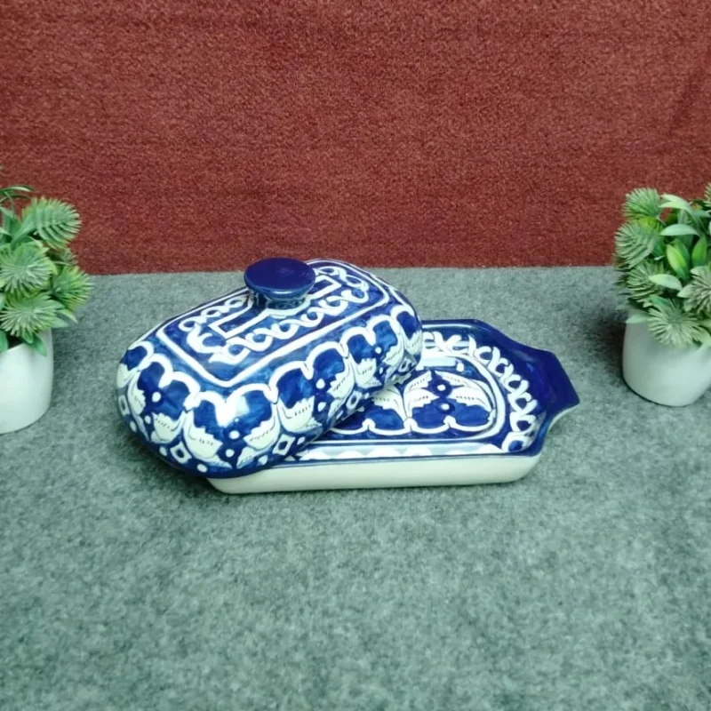 Multani blue pottery butter dish with ceramic lid tilted open on the tray