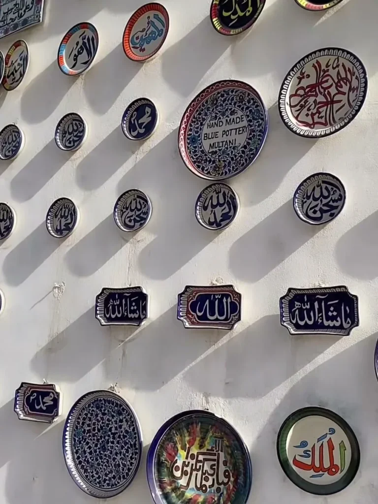 Calligraphy plates on the wall outside the showroom
