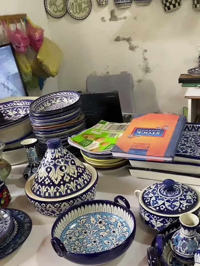 A display table in the showroom, serving dishes and tea pots