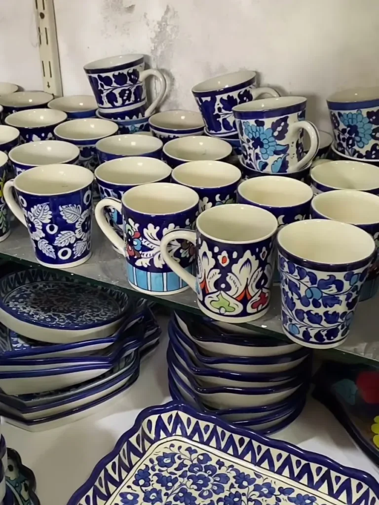 Rows of hand painted mugs in the display centre