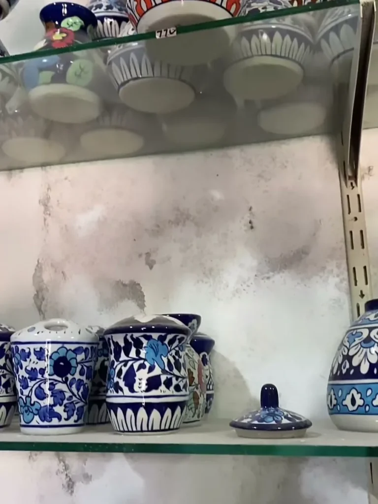 Mugs and jugs on a shelf in the display centre