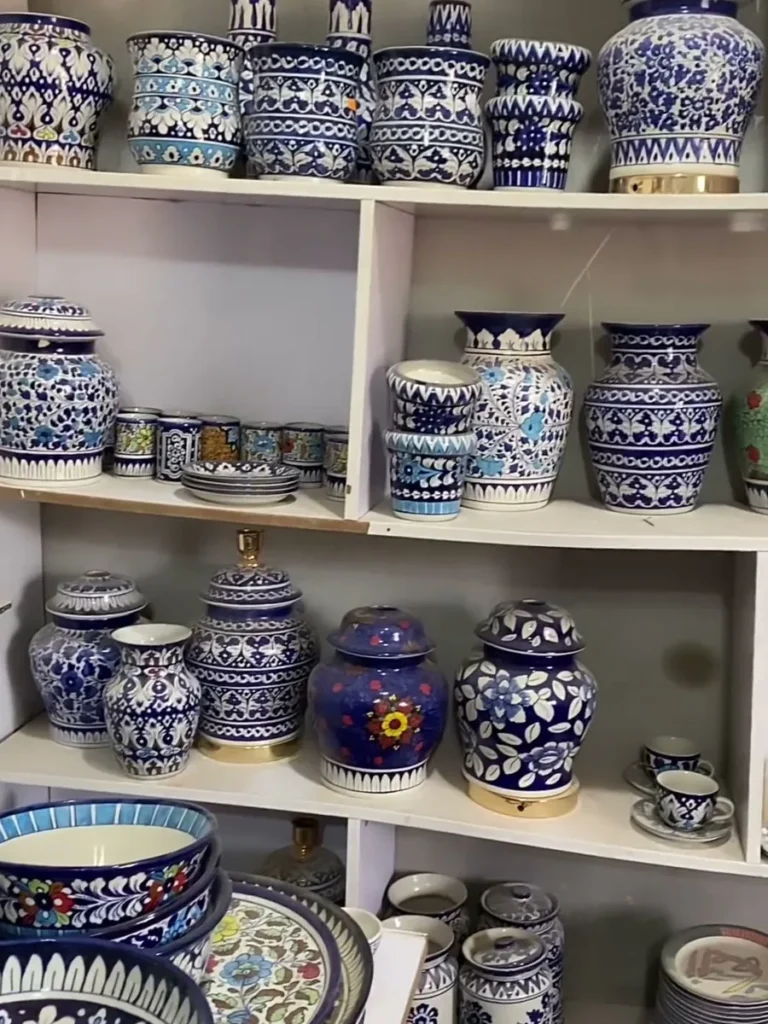 Shelves of pots and plates in the showroom