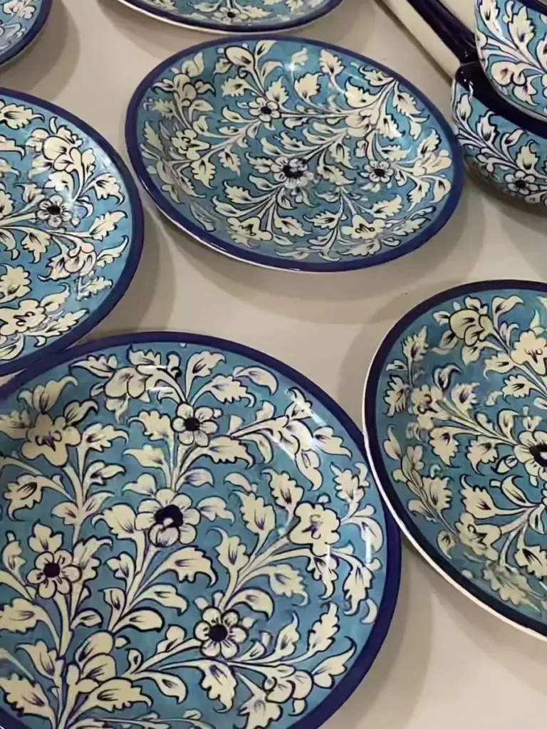 Hand painted plates laid out after painting