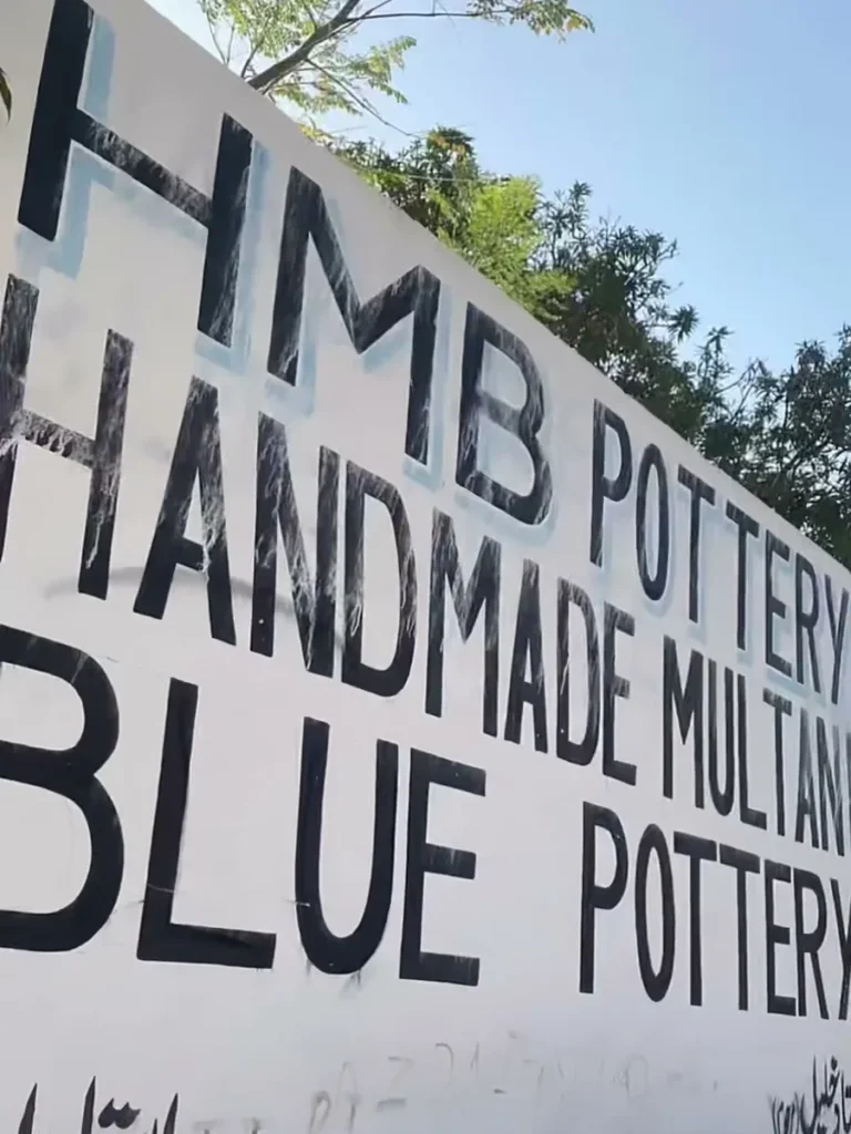 The HMB Pottery sign on the factory wall, handmade Multani blue pottery
